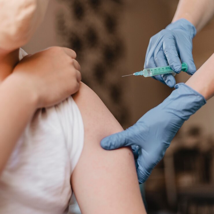 doctor-giving-child-vaccine-while-wearing-gloves_23-2148801372